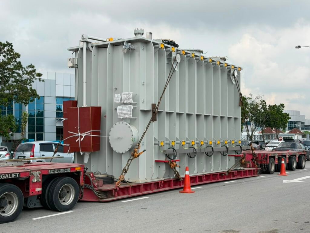 A large transformer secured on a heavy transport trailer at a data centre project in Malaysia.